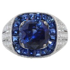 This is a 5.35 carats royal blue sapphire that is surrounded by a stunning halo of round brilliant diamonds. This spectacular Platinum custom made ring truly displays the incredible beauty of the round shaped Blue Sapphire. The 0.46 carat total weight of diamonds that highlight the beauty of the center gem. Diamond Fashion Rings, Fashion Ring, Round Cut Diamond, Cut And Style, Round Brilliant, Blue Sapphire, Fashion Rings, Round Cut, Royal Blue