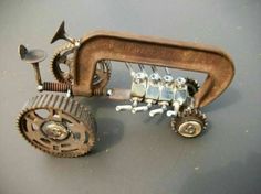 a toy tractor made out of metal parts