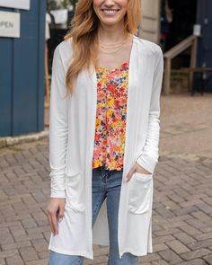 Front view of Ivory Casual Day Modal Cardigan Chic Spring Solid Color Cardigan, Cream Long Sleeve Cardigan For Spring, White Spring Cardigan For Layering, White Spring Outerwear For Layering, White Open Front Outerwear For Daywear, White Outerwear For Spring Layering, White Open Front Top For Fall, White Open Front Tops For Fall, Versatile Open Front Tops For Spring