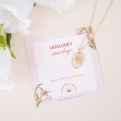 Our January Birth Flower Necklace is a gorgeous addition to our new Birth Flower Necklace Collection! This dainty necklace features a beautiful Snow Drop, the January birth flower, symbolizing love and luck. What do we love about it? The Snow Drop is delicately crafted to showcase its beauty, and the pendant is perfectly sized to be chic yet modern. It's a perfect gift for someone born in January, for a loved one or for anyone who appreciates the beauty and meaning of the Snow Drop flower! ‎ Flo Dainty May Birthstone Charm Necklace As Gift, Delicate May Birthstone Necklaces For Her, Spiritual Birth Flower Pendant Charm Necklace, Spiritual Birth Flower Pendant Necklace, Feminine Flower Pendant Jewelry For Gift, Feminine Round Pendant Jewelry Gift, Dainty Birth Flower Charm Necklace, Dainty Birth Flower Charm Necklace With Flower Pendant, Dainty Birth Flower Charm Necklaces