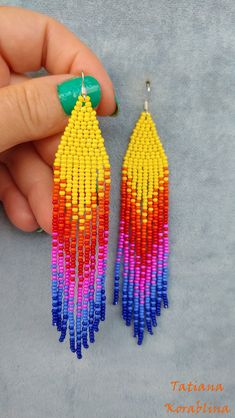 These handmade unique earrings are made of high-quality Czech beads and strong synthetic thread. I use my author's scheme. They are elegant, fashionable, and highly versatile, suitable for everyday wear. There may be some color discrepancies which is due to the different monitor settings. 100% hand made with love! Measurements: Length-about 12cm (4.72 inch) Width -about 2 cm (0.8 inch) Materials: Sterling silver components Czech glass beads Strong bead weaving thread Rainbow Beaded Fringe Earrings For Gift, Handmade Multicolor Tassel Drop Earrings, Vibrant Rainbow Dangle Earrings, Handmade Multicolor Dangle Tassel Earrings, Rainbow Dangle Tassel Earrings Gift, Rainbow Tassel Earrings For Gifts, Rainbow Tassel Dangle Earrings, Colorful Handmade Dangle Tassel Earrings, Rainbow Dangle Tassel Earrings