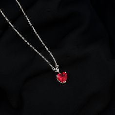 Product Details Experience the elegance of simplicity with this Created Ruby Heart Necklace, symbolizing courage and unshakable willpower in life. Adorned with a classic heart-shaped Created Ruby in a prong setting, this created ruby necklace is the perfect accessory for your wedding anniversary or any special occasion. Product Information SKU SHP-PENDANT042167670 Weight 2.48 gm (Approximate) LAB CREATED RUBY INFORMATION No.of Stones 1 Pieces Total Weight 2.00 Carat (Approximate) Dimension(appro Ruby Heart Necklace, Ruby Heart, Solitaire Necklace, Ruby Necklace, Solitaire Necklaces, Signature Jewelry, Timeless Jewelry, Conflict Free Diamonds, Free Jewelry