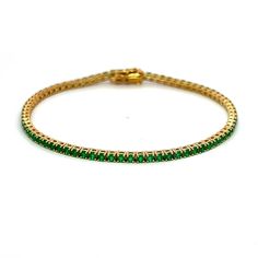 Exquisite and perfectly blended tsavorite garnet tennis bracelet, by Alexander Beverly Hills. 75 round tsavorite garnets, 2.45 carats total. Four prong set in 18-karat yellow gold, 7.75 grams, 7 inches. Accommodated with an up-to-date digital appraisal by a GIA G.G. once purchased, upon request. Please contact us with any questions. Classic Green Round Diamond Bracelet, Luxury Green Round Tennis Bracelet, Classic Green Round Tennis Bracelet, Green Gemstone Diamond Bracelet, Green Gemstone Tennis Bracelet, Round Emerald Tennis Bracelet As Gift, Round Emerald Tennis Bracelet Gift, Emerald Tennis Bracelet Gift, Green Round Tennis Bracelet With Prong Setting