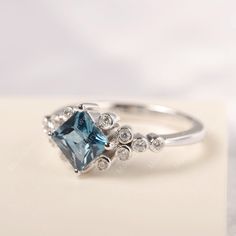 All HANDMADE ITEMS SHIP IN APPROX 8 DAYS Main Stone: Genuine London blue topaz Main Stone Size: Princess cut 6 mm x 6 mm Main Stone Weight: 1.29 carat Side Stone: CZ Height From The Ring Setting Bottom(to gemstone top): about 5.38 mm Width of Ring band Measure: gradually varied,about 1.55 to 2.32 mm Material: 925 Sterling Silver/14K White Gold/14K Yellow Gold/14k Rose Gold Engraved: Available For FreeNo more than 13 letters) Customized:Of course! Tell me what you want Includes With Order: All of Silver Princess Cut Gemstone Birthstone Ring, Silver Princess Cut Birthstone Ring With Gemstone, Blue Square Cut Topaz Ring Gift, Gift Blue Square Cut Topaz Ring, Blue Topaz Ring With Princess Cut Fine Jewelry, Blue Topaz Princess Cut Ring Fine Jewelry, Blue Princess Cut Topaz Ring In Fine Jewelry Style, Formal Princess Cut Blue Topaz Ring, Blue Topaz Princess Cut Ring In Sterling Silver