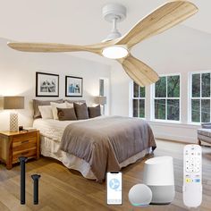 a bed room with a neatly made bed and a ceiling fan next to the bed