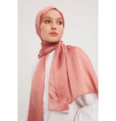 Shine Hijab Shawl - Salmon Glossy in texture and elegant in appearance, our shine shawl is set to be the next great addition to your wardrobe! Its sleek shine makes for an impressive final touch to formal wear so you could look and feel your best on any special occasion. FEATURES: - Glossy finish - Suitable for all seasons - Opaque (not transparent) MATERIAL: - 75 cm x 185 cm - Polyester CARE: - Hand wash separately in cold water. - Lay flat to dry. - Iron on low without steam. Made in Turkey Elegant Shawl For Eid And Formal Occasions, Elegant Shawl For Formal Eid Occasions, Elegant Formal Shawl For Eid, Elegant Silk Scarf For Eid, Elegant Formal Shawl For Festive Occasions, Chic Solid Color Formal Scarves, Elegant Festive Shawl For Formal Occasions, Elegant Formal Festive Shawl, Formal Solid Color Satin Scarves