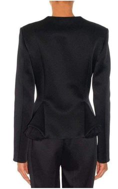 This black Christopher Kane jacket features a high rounded neck and a tailored construction with godet at the front accented with tulle. Hidden front hook and eye closures. 70% polyamide, 17% viscose, 13% acetate. Fully lined. This style runs true to size.Made in Italy Size UK8 Bust 33" Waist 28" Length shoulder to hem:23" Structured Long Sleeve Blazer For Party, Structured Long Sleeve Party Blazer, Structured Blazer For Evening And Fall, Elegant Evening Outerwear With Stand Collar, Structured Blazer For Evening In Fall, Fitted Outerwear With Stand Collar For Evening, Fitted Black Outerwear With Concealed Front Fastening, Fitted Evening Outerwear With Stand Collar, Tailored Evening Outerwear With Concealed Front Fastening