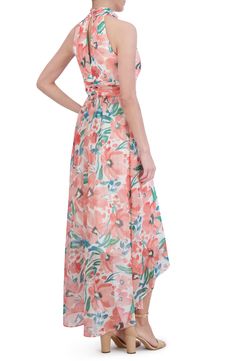 Bring the garden to the party in a flower-filled dress designed for flow with a high-low hemline. 43" to 57" center front length (size 8) Hidden back zip; keyhole with button-and-loop closure High neck Sleeveless, with cutaway shoulders Partially lined 100% polyester Hand wash, dry flat Imported High Neck Sleeveless, Chiffon Gown, Eliza J, Floral Sleeveless, The Garden, High & Low, High Low, Designer Dresses, Special Occasion