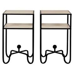 two black metal and glass side tables