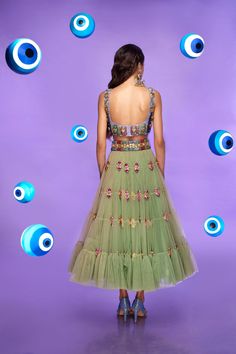 A tiered tulle half Lehenga in moss green embellished with glass stones and metal pieces. Paired with an original Papa Don't Preach tab bralette in lilac embellished with glass cut beads.From Papa Don’t Preach’s Nazar Na Lage collection. DELIVERY TIMEPlease allow 8-12 weeks for your outfit to arrive. FABRIC DETAILSTulle. Professional cleaning only. Organza Tiered Skirt Lehenga For Party, Organza Tiered Lehenga For Party, Organza Lehenga With Tiered Skirt For Party, Glamorous Green Choli With Mirror Work, Glamorous Green Embellished Choli, Green Hand Embellished Lehenga For Party, Glamorous Green Lehenga For Reception, Glamorous Green Choli For Festive Season, Glamorous Green Choli For Festive Occasions