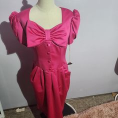 Brand: Vintage Size: 13/14 Color: Pink Condition: New With Tags, Has Small Mark As Seen Stretch: No Stretch Measurements: 40 Long, 12 Sleeve, 16 Pit To Pit, 32 Waist Key Words: Zipper Closure, Puff Sleeve, Big Bow, Pockets Nonsmoking Same Day Or Next Day Shipping Offers & Bundles Welcome *Measurements Can Vary Slightly Vintage Puff Sleeve Mini Dress For Party, Vintage Puff Sleeve Party Mini Dress, Fitted Mini Dress With Bow And Short Sleeves, Pink Puff Sleeve Dress With Bow, Pink Puff Sleeve Formal Dress, Puff Sleeve Dress With Bow For Party, Retro Square Neck Party Dress, Fitted Feminine Dress For Dress-up, Fitted Feminine Dress For Dress-up Occasions