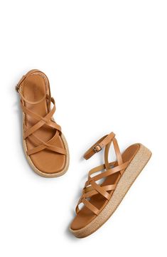 Woven trim highlights the earthy platform sole of this strappy, vacation-ready sandal. Adjustable ankle strap with buckle closure; hidden elastic inset Leather upper and lining/rubber and synthetic sole Imported Strappy Wedge Sandals With Buckle For Beach, Strappy Wedge Sandals With Buckle Closure For Beach, Strappy Wedge Sandals With Adjustable Strap For Beach, Leather Strap Wedge Sandals For Beach, Vacation Synthetic Footbed Sandals With Ankle Strap, Vacation Strappy Wedge Sandals With Buckle, Strappy Wedge Sandals With Buckle For Vacation, Synthetic Ankle Strap Footbed Sandals For Vacation, Strappy Wedge Sandals With Buckle Closure For Vacation