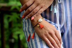 Bright and boho, our handmade hematite beaded bracelets provide the perfect amount of sparkle to look just as pretty with cutoffs and tanks as they do with sundresses! Features: Handwoven of satin threads with a beautiful sheen A sparkly natural hematite stone band Shell accent with satin thread tassels Adjustable sizing - 10.5 inches to first knot, total length 16.5 inches. Thread Tassels, Beaded Shell, Hematite Stone, Tassel Bracelet, Hematite Beads, Shell Beads, Jewelry Tutorials, Rope Bracelet, Mens Bracelet