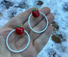 Vintage candy apple earrings enamel hoop red white mod rockabilly jewelry ITEM DESCRIPTION: Offering these fun enamel red apple and white hoop Earrings. These little apples (or cherries) are so cute!  MEASUREMENTS: These earrings measure approximately 1 5/8 inches diameter. CONDITION: These Earrings are in good vintage condition. No issues. POLICIES: Please keep in mind, I am not an expert in jewelry or vintage items. I do my best to research the item and its history and pass that information on Retro Hoop Jewelry As A Gift, Retro Hoop Jewelry For Gifts, Cute White Hoop Earrings For Gifts, Retro Small Hoop Jewelry Gift, Retro White Earrings For Gift, Retro White Round Jewelry, White Enamel Hoop Earrings For Gifts, White Novelty Enamel Jewelry, Fun Red Round Jewelry