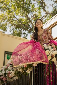 Hot Pink Lehenga and Open Frock Pakistani Bridal Dress is a breathtaking traditional masterpiece to have a dreamy royal appearance. Lavish designs and hand-crafted embellishments of gota and zardosi make this stunning Mehndi Dress your foremost priority for the big day. Pishwas: Pishwas Frock in an alluring purple sade is emblazoned with classic gota details. Threads and Sequin embellishments enhance the glamour of this beautiful Pakistani Bridal Pishwas in a front open style. Floral details, mu Georgette Anarkali Set For Traditional Ceremonies During Diwali, Wedding Dresses In Raw Silk With Gota Work, Raw Silk Wedding Dress With Gota Work, Raw Silk Dress With Gota Work For Wedding, Traditional Georgette Gown With Intricate Embroidery, Unstitched Anarkali Set For Traditional Ceremonies, Semi-stitched Gown For Diwali And Traditional Ceremonies, Unstitched Floor-length Anarkali Set For Traditional Ceremonies, Unstitched Floor-length Anarkali Set For Ceremonies