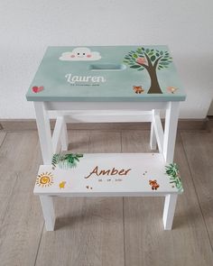 a wooden stool with an animal theme painted on the side and personalized step stool