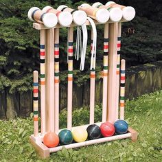 an outdoor game set made out of croquets and balls