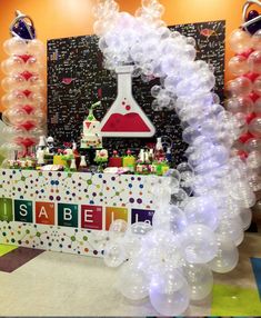 an arch made out of balloons and streamers