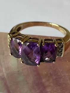 Vintage - Amethyst and Diamond 9ct Gold Three Stone Ring - in a stepped claw setting, with three claw set diamonds either side - c1980's. The three Stone Amethyst is Facet Cut and graduated. Stunning vintage statement ring/ engagment ring - graduation present. Ring Size - N/O UK - US 7 1/4 Luxury Vintage Amethyst Ring With Polished Finish, Luxury Antique Amethyst Ring, Luxury Vintage Gold Amethyst Ring, Antique Amethyst Ring Gold, Vintage Amethyst Ring, Amethyst Ring Vintage, Graduation Present, Claw Setting, Three Stone Ring