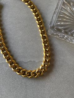 Chunky and trendy cuban link necklace. Pair with XL Cuban Link Bracelet for a complete matching look. -16" cuban link chain -12mm cuban links -18k gold plating over stainless steel -Waterproof, Tarnish resistant Cuban Link Bracelet, Cuban Link Necklace, Cuban Link Chain, Cuban Chain, Cuban Link, Link Necklace, Link Chain, Gold Plating, Link Bracelets