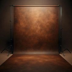 an empty photo studio with brown backdrop