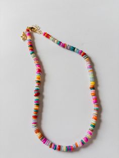 Handmade beaded necklace with colorful gemstone heshi beads Perfect addition to summer stacks Bohemian Rainbow Jewelry With Letter Beads, Rainbow Heishi Bead Necklaces With Letter Beads, Multicolor Heishi Beads Jewelry With Colorful Beads, Bohemian Spacer Beads Necklace For Vacation, Colorful Bohemian Jewelry With Letter Beads, Colorful Bohemian Letter Beads Jewelry, Bohemian Beaded Necklaces With Spacer Beads For Vacation, Bohemian Beaded Necklaces With Letter Beads, Bohemian Beaded Necklace With Letter Beads