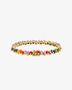 Discover the elegance of our Princess Milli Tennis Bracelet, featuring 10.50 carats of princess-cut rainbow sapphires in a unique staggered setting. Perfect for layering or making a sophisticated statement on its own, this bracelet offers versatile styling options to enhance any ensemble. Details 18k yellow gold 10.50 carats of 3x3mm princess-cut rainbow sapphires Bracelet measures 7" inches in length Box clasp with safety lock fastening 5.75mm width Ref: AKB540 Luxury Multicolor Cubic Zirconia Tennis Bracelet, Elegant Rainbow Cubic Zirconia Jewelry, Elegant Rainbow Colored Bangle Jewelry, Elegant Multicolor Cubic Zirconia Bracelets, Luxury Multi-stone Cubic Zirconia Tennis Bracelet, Luxury Cubic Zirconia Multi-stone Tennis Bracelet, Fine Jewelry Multicolor Cubic Zirconia Tennis Bracelet, Elegant Rainbow Jewelry With Sparkling Stones, Elegant Rainbow Round Bracelets