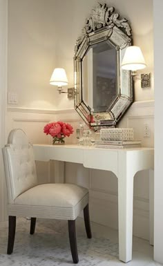 a white desk with a chair and mirror