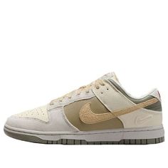 The Nike Dunk Low combines retro flair with modern comfort. Crafted from a mix of leather and textile, these kicks pay homage to '80s basketball aesthetics. The padded, low-cut collar ensures all-day comfort, whether you’re hitting the court or strolling the streets. The colorway features a sophisticated blend of Coconut Milk, Sesame, Alabaster, Light Bone, Neutral Olive, and Dark Stucco. With its extra Swoosh on the heel, this Dunk Low is a stylish nod to the past, perfect for sneaker enthusias Vintage Nike Sneakers With Boost Midsole, Vintage Nike Sneakers With Boost Technology, Vintage Nike Custom Sneakers For Streetwear, Throwback Round Toe Skate Shoes For Streetwear, Retro Custom Sneakers With Gum Sole For Sports, Throwback Low-top Skate Shoes For Streetwear, Nike Retro Basketball Shoes With Boost Midsole, Nike Retro Sneakers For Skateboarding, Vintage Nike High-top Sneakers For Streetwear