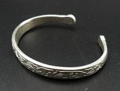 "Vintage silver tone Chinese style cuff, In good vintage condition. Measures 2\" ¾ x 2\" ¼ ( out side edge to edge ). 2\" 5/8 x 2\" ( In side edge ) and 8 mm thick. Thanks." Nickel Free Silver Cuff Bracelet, Nickel Free Silver Cuff Bangle, Adjustable Etched Silver Cuff Bracelet, Adjustable Silver Etched Cuff Bracelet, Formal Etched Silver Cuff Bracelet, Formal Silver Etched Cuff Bracelet, Vintage Silver Etched Cuff Bracelet, Silver Metal Cuff Bangle, Silver Etched Cuff Bracelet