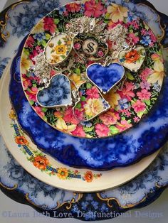 a blue plate with flowers and hearts on it