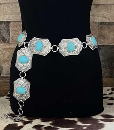 Turquoise Skys Western Concho Belt Get ready to add some western charm to your wardrobe with our Turquoise Skys Western Concho Belt. Not only does it feature beautiful faux turquoise accents, but it also includes adjustable hooks for a perfect fit every time. The size option of Large/XL ensure that this belt will be a stylish addition to any outfit. Wrangle up some compliments with this eye-catching accessory! Western Concho Belt, Turquoise Western Style Summer Jewelry, Western Blue Jewelry For The Beach, Southwestern Clothing, Western Chic Fashion, Painted Hats, Silver Chain For Men, Buckles Fashion, Concho Belt