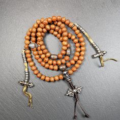 ❤This bodhi beads mala is made by Tibetan craftsmen and come from Hepo Town, Baiyu County, the birthplace of the famous Tibetan handicrafts,about 30 years old, hold and blessed by a lama in Baiyu Monastery.It is composed of 108 bodhi seed beads, and is equipped with 3 cold iron dzi beads, cold iron bead counters are installed on both sides, 1 mani jewel bead clip,and finally consists a skull guru bead and vajra on the end, very elegant.❤Details1. Handmade 108 bodhi beads approximately 8-9mm,mala Handmade Spiritual Mala For Rituals, Spiritual Healing Brown Beads, Brown Wooden Beads Jewelry For Puja, Handmade Spiritual Mala For Puja, Orange Jewelry With 108 Beads For Meditation, 8mm Amber Beads For Spiritual Use, 8mm Amber Spiritual Beads, Brown Spiritual Beads For Meditation, Hand-strung Brown Mala For Healing