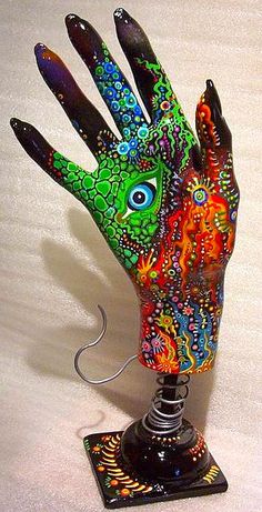 a colorful hand lamp on top of a table