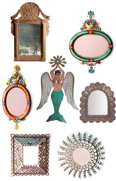 there are many different mirrors and frames on this white wall, including one with an angel