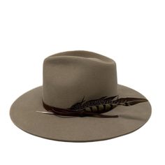 Tall crown in a stockman felt makes this fedora stiff to the touch with no movement. wrapped with suede and adorned with a feather she is a show stopper. It should fit high on your head . please size up if you are in between sizes . Made in the USA. exchange or site credit only sm 21-22 inch circ md 22-23 inch circ lg 23-24 inch circ Rodeo Fedora Felt Hat With Feather Trim, Western Fedora With Feathers And Flat Brim, Western Style Fedora With Feathers And Flat Brim, Felt Fedora With Feather Trim For Rodeo, Western Wide-brim Fedora With Feathers, Western Style Brimmed Fedora With Feathers, Western Wide Brim Fedora With Feather Trim, Winter Feathered Flat Brim Felt Hat, Winter Felt Hat With Feathers And Flat Brim