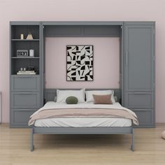 a bed sitting under a book shelf next to a wall mounted cabinet in a bedroom