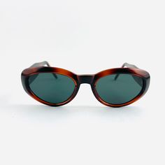 vintage 90s oval sunglasses . Red tortoise shell frame 400 uv New Deadstock excellent condition includes sunglasses pouch Retro Tortoiseshell Cat Eye Sunglasses With Tinted Lenses, Retro Oval Brown Sunglasses, Retro Brown Oval Sunglasses, Retro Tortoiseshell Cat Eye Sunglasses, Vintage Oval Sunglasses With Uv Protection, Dapper Day Outfits, Sunglasses Pouch, Cloudy Weather, Shell Frame