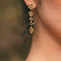 Charming botanical motifs cascade elegantly in this hand hammered and luxuriously lightweight pair. Brass with sterling silver posts. Nickel and lead free. 1.5" [5 cm] long. Botanical Motifs, Bali Earrings, Long Earring, Bamboo Earrings, Witch Jewelry, Moon Jewelry, Diamonds And Gold, Fantasy Jewelry, Elegant Accessories