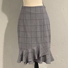 Banana Republic. Nwt. Beautiful, Grey, Windowpane, Tulip Shaped, Pencil Skirt. This Gorgeous Skirt Is Slightly Fitted With A Bit Of Stretch To Provide A Flattering Fit Perfect For The Office Or After Work Happy Hour. This Skirt Features A Ruffle, Tulip Shaped Hem And Hits Below The Knee. Wool/Spandex/Polyester Blend. Size 2, Brand New, Never Been Worn. Nwt. Elegant Fitted Plaid Skirt, Fitted Plaid Pencil Skirt, Fitted Plaid Pencil Skirt For Work, Fitted Knee-length Plaid Bottoms, Fitted Plaid Skirt For Office, Chic Fitted Plaid Skirt, Fitted Plaid Mini Skirt For Work, Fitted Ruffled Skirt For Work, Fitted Ruffled Mini Skirt For Workwear