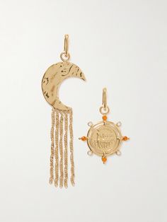 Rabanne's earrings are purposely mismatched to depict the sun and the moon. Handmade from gold-tone metal, they have an oval hoop shape with a crystal-detailed coin charm suspended from one and strands of delicate chains hanging from the other. Wear yours day or night. Celestial Single Earring In Yellow Gold, Celestial Yellow Gold Single Earring, Yellow Gold Dangle Coin Pendant Jewelry, Yellow Gold Coin Pendant Dangle Jewelry, Yellow Gold Dangle Jewelry With Coin Pendant, Gold Symbolic Earrings With Sun And Moon Design, Symbolic Gold Earrings With Sun And Moon Design, Yellow Gold Moon Charm Drop Earrings, Gold Symbolic Moon Charm Earrings