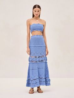 This strapless crochet crop top features a delicate scalloped edge that adds a touch of femininity. Pair it with the matching Jana Skirt for a cohesive and elegant look, or layer it under the Vosen Top for added dimension and style. Whether you're dressing up for a special event or embracing a chic, casual vibe, the Li Island Chic Outfit, Greece Fits, Summer Embroidered Blue Sets, Chic Fitted Blue Crochet Top, Summer Embellished Blue Skirt, Blue Embroidered Summer Sets, Vacation Blue Ruffled Mini Skirt, All Blue Outfit, Royal Blue Outfits