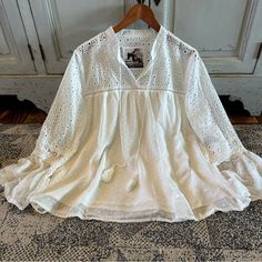 We Are Obsessed With This Boho Vintage Style Boutique Labeled Blouse. This Pretty Blouse Features A Soft White Chiffon Base, V-Neck Eyelet Cut Out Lace Details And Feminine Fit. + Well Made + True To Size + Model Is 5'8" / 140 Lbs And Modeling A Size Medium + Polyester / Imported Approx. Measurements: Small: Pit To Pit: 19", Length: 23" Medium: Pit To Pit: 20", Length: 23" Large: Pit To Pit: 21", Length: 24" Xl: Pit To Pit: 22", Length: 25" ** Double Pit To Pit For Total Bust Brand New With Tags White Lace Patchwork Blouse, Feminine White Blouse With Lace Patchwork, Spring Brunch Blouse With Lace Patchwork, Spring Blouse With Lace Patchwork For Brunch, Spring Day Out Blouse With Lace Patchwork, Lace Patchwork Blouse For Day Out In Spring, Lace Patchwork Blouse For Spring Day Out, Spring Blouse With Lace Patchwork For Day Out, White V-neck Blouse With Lace Top