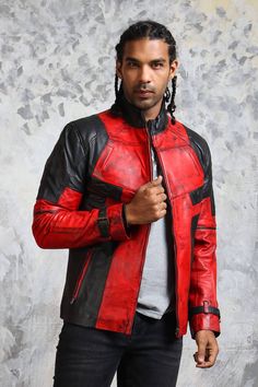 Hand Waxed Red and Black Leather Biker Jacket Red leather jackets are known to be a total head-turner with their edgy yet eye-catching color and accent detailing. This red and black leather jacket is manufactured with 100% genuine leather promising quality, comfort, adherence and warmth. Bare minimum yet strategic pairing is what makes this red biker jacket stand out from the masses. It features a front zipper closure, adjustable belted sleeves, stand-up collar and spacious zipper pockets on its Luxury Red Biker Jacket For Biker Events, Luxury Red Leather Jacket For Men, Luxury Red Biker Outerwear, Luxury Red Biker Jacket For Motorcycling, Luxury Red Biker Jacket For Motorcycle Events, Luxury Red Leather Jacket For Biker Events, Luxury Red Leather Jacket For Streetwear, Casual Luxury Red Biker Jacket, Red Biker Outerwear For Events