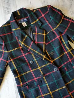 Snazzy retro jacket Plaid / windowpane tweed blazer Size 4 Petite Preppy and versatile Jacket is in very nice vintage condition Great assets such as: Medium size shoulder pads (just enough to define, not huge) 2 front pockets Fully lined Extra sleeve seam for better style and comfort One button closure Black with red, green and yellow  Clean * Sharp * Classic Please study photos for added description and measurements Thank you for visiting MidWestMerc! Vintage Notch Lapel Tweed Jacket For Office, Vintage Tweed Jacket With Notch Lapel For Office, Vintage Wool Tweed Jacket For Office, Plaid Wool Blazer With Buttons, Retro Houndstooth Blazer For Winter, Retro Double-breasted Winter Blazer, Retro Houndstooth Winter Blazer, Vintage Wool Sport Coat For Office, Retro Plaid Blazer For Formal Occasions