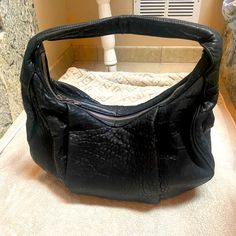 This Is A Gently Used Beautiful Black Pebbled Leather Alexander Wang “Morgan” Hobo Bag. I Bought This Gently Used For Work But It’s Too Big (I Needed A Black Bag). No Obvious Signs Of Wear. It’s Very Roomy And Interior Is Clean. No Odor. See Photos For Size. The Bottom Is Studded, Which Is A Stunning Accent To This Purse. There Are 2 Exterior Zipper Pockets, 1 Interior Zipper Pocket And 2 Interior Slip Pockets. Thank You For Viewing My Items. Pet And Smoke Free Home Everyday Pebbled Leather Shoulder Bag With Gunmetal Hardware, Everyday Shoulder Bag With Gunmetal Hardware And Pebbled Leather, Leather-backed Hobo Bag For Evening, Pebbled Leather Tote Shoulder Bag With Silver-tone Hardware, Black Pebbled Leather Bag With Gunmetal Hardware, Leather Hobo Bag With Leather Backing For Evening, Designer Textured Leather Hobo Bag, Pebbled Leather Satchel With Silver-tone Hardware, Leather Hobo Bag With Silver-tone Hardware