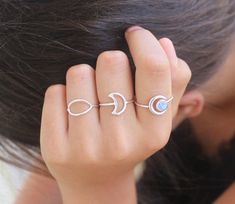 The Outline Moon Ring finds its beauty in its simplicity.Sterling silver shaped in a funky moon shape, made to hug your finger so you never have to take it off ♡.   Easy to style and stack with other rings as it is to wear by itself.Details:This list is for ONE Outline Moon Ring, styled and stack with other rings (not included) all available in our shop.Please remember that each piece is handmade, therefore no two are alike - similar but unique.•► Material: handcrafetd from 925 sterling silver a Minimalist Adjustable Crescent Ring, Dainty Adjustable Moon-shaped Midi Rings, Dainty Adjustable Moon Shape Midi Rings, Adjustable Minimalist Moonstone Ring, Minimalist Sterling Silver Moon Midi Rings, Minimalist Adjustable Moon Phase Rings, Adjustable Minimalist Moon Midi Rings, Minimalist Moon Phase Open Ring Jewelry, Minimalist Moon Phase Midi Rings As Gift