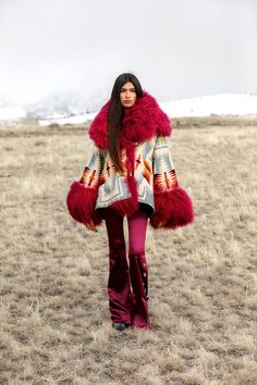 Most Orders Ship within 1-2 Business Days Bell shaped hooded cloak with a hood and sleeve lining of Mongolian Lambs fur with welt patch pockets and 2 toggle closure. Celeste is 5'10" and wears size OS. Napped Pendleton blankets: 82% Wool, 18% Cotton. Wool Cashmere facings and Silk Rayon peachskin lining. Beetroot Pink Mongolian Fur is a shaggy long hair Mongolian sheep shearling. One of the most popular designs ever made by Pendelton, crafted of USA-made wool from their Oregon mill. In 1923, Pre Pendleton Blankets, Shaggy Long Hair, Mongolian Fur, Mongolian Lamb, Pendleton Blanket, Cowboy Caviar, Fabulous Furs, Hooded Cloak, Popular Designs