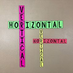 a cross made out of scrabble tiles with words written on it that say horizontal and horizontal