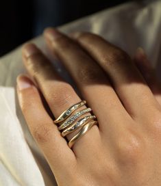 Here's a glittering dose of modern glam to wear on its own or add to your stack. Delicate yet bold, unexpected and symbolic, .10 carats of diamonds float across your finger in our Novi Diamond Stack ring. Shop all stacking rings! #stackingring #engagementring #diamondband #engagementband Flush Set Diamond, Stacked Diamond Bands, Diamond Ear Cuff, Space Jewelry, Diamond Stacks, Diamond Stacking Rings, Organic Lines, Stack Ring, Stacking Bands